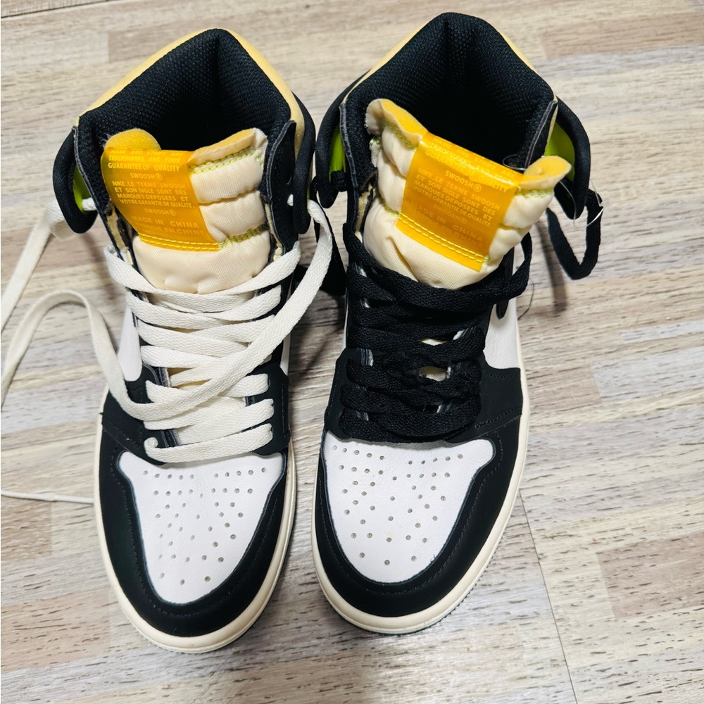 Black and White High-Top Sneakers with Yellow Accents